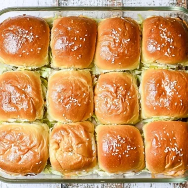 Delicious Big Mac sliders served on a platter with toppings.