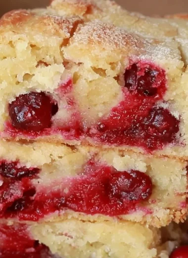 Cozy Cranberry Christmas Cake decorated with festive toppings.