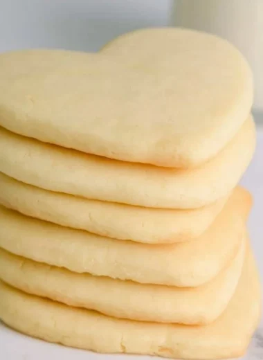 Cozy cut-out sugar cookies shaped like festive holiday symbols.