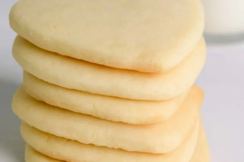 Cozy cut-out sugar cookies shaped like festive holiday symbols.