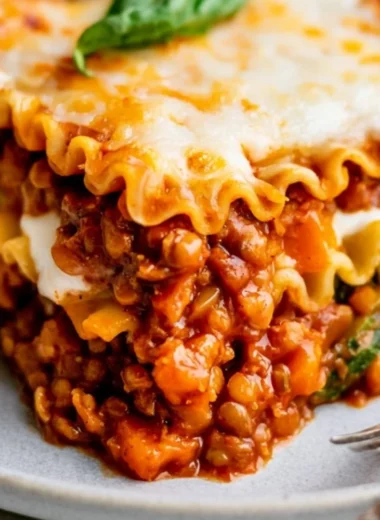 Delicious easy vegan lentil lasagna layered with fresh vegetables and sauce