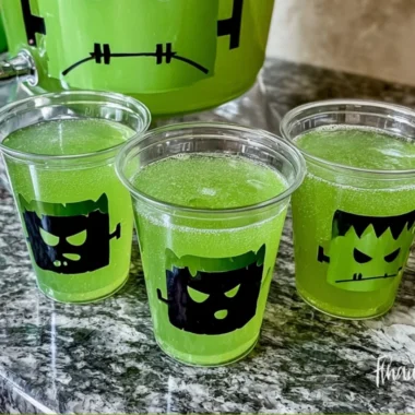 Frankenstein Green Punch cocktail in a spooky Halloween setting.