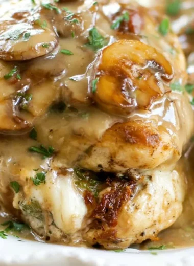 Olive Garden's Stuffed Chicken Marsala plated with a side of vegetables and sauce