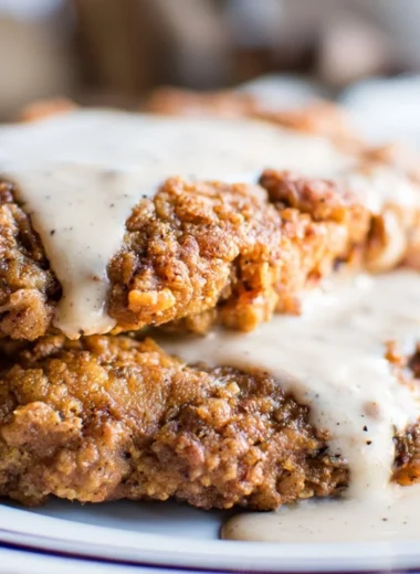 Delicious Texas chicken fried steak with crispy coating and savory gravy.