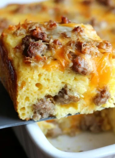 Delicious sausage cornbread casserole topped with herbs and spices