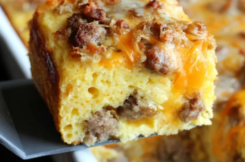 Delicious sausage cornbread casserole topped with herbs and spices