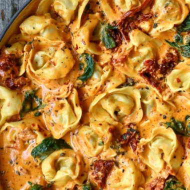 Delicious Marry Me Tortellini served with fresh herbs and tomatoes