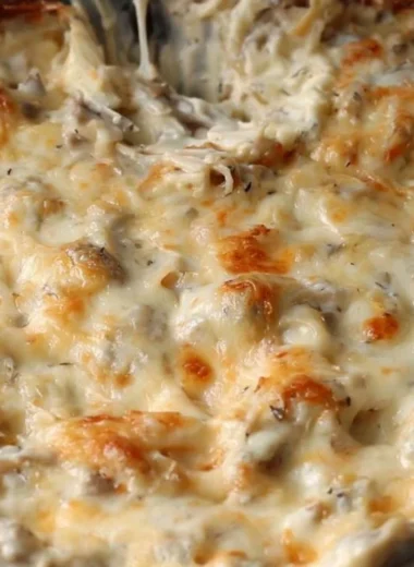 Delicious Stuffed Mushroom Dip served in a bowl with crackers